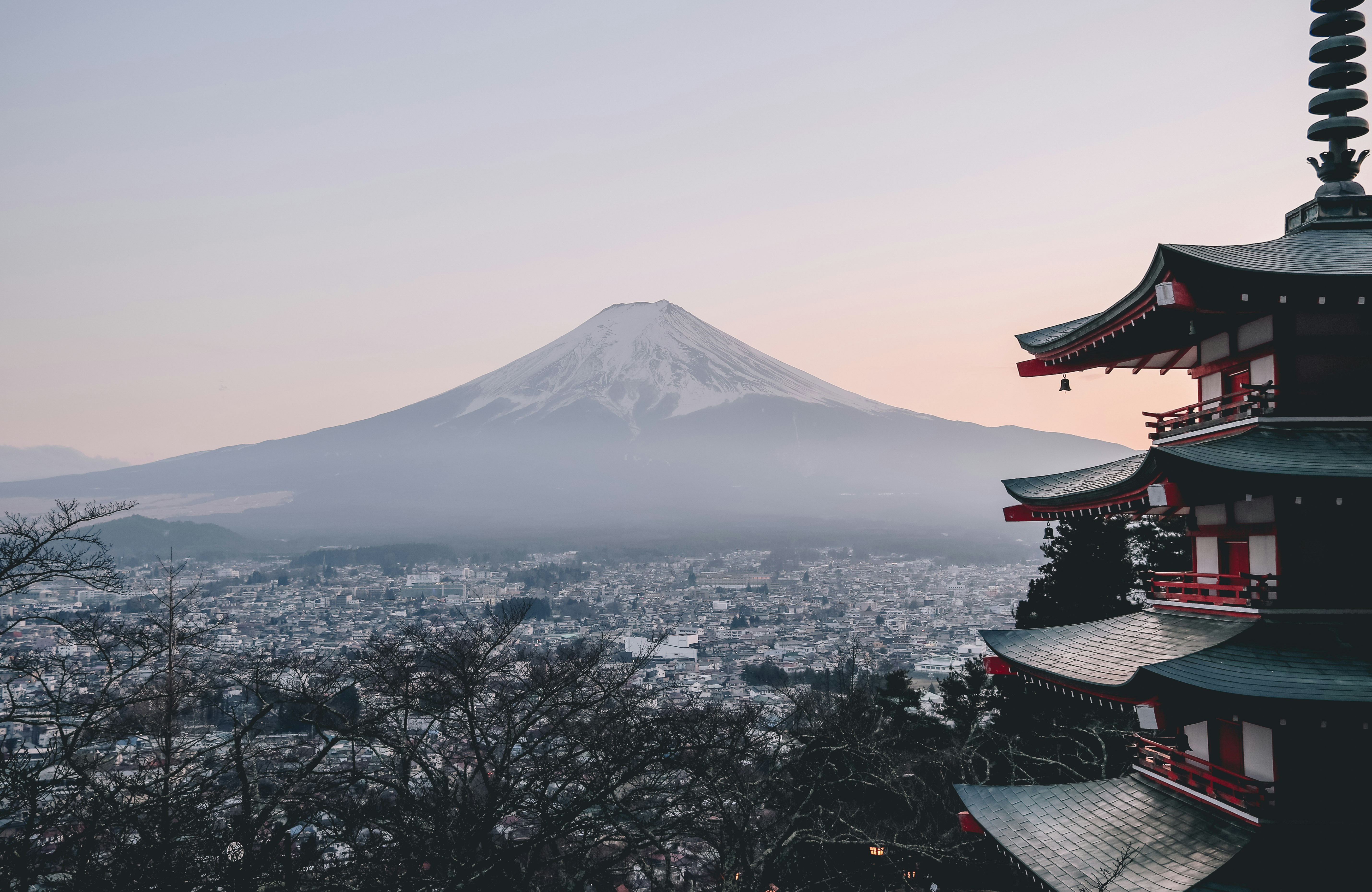Snowy Japanese mountain landscape with traditional rooftop